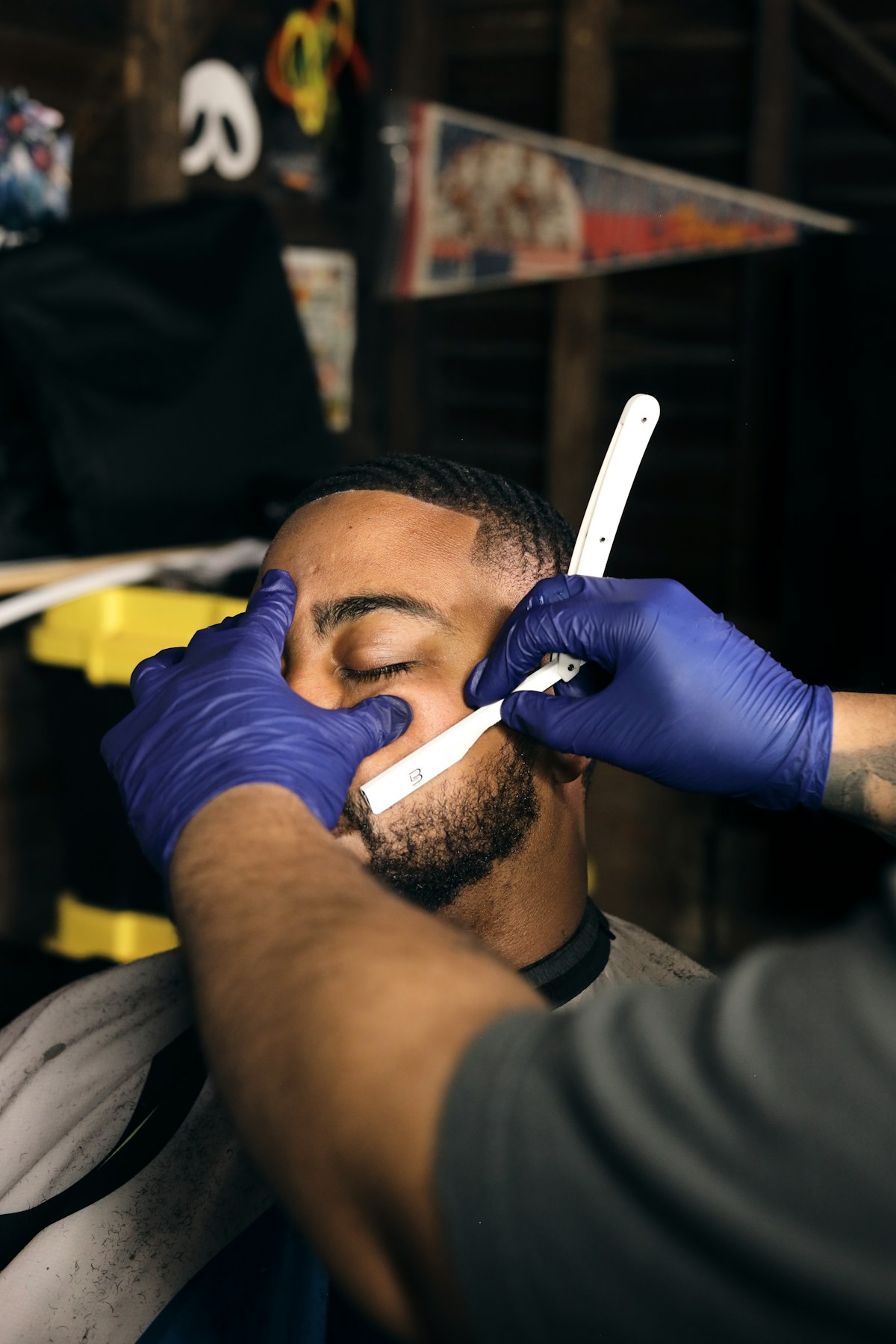 A barber finishing a fresh haircut