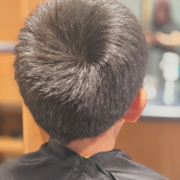 Back view showing the clean shape and blend of a kids adventure cut