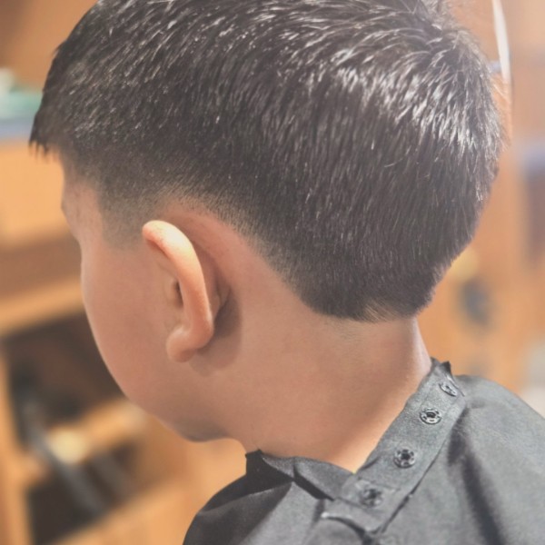 Close view of the smooth fade and clean outline on a kids adventure cut