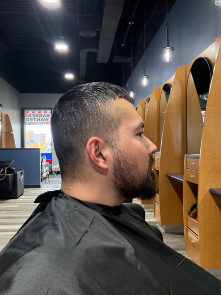 Profile view of a finished modern fade and beard shape-up