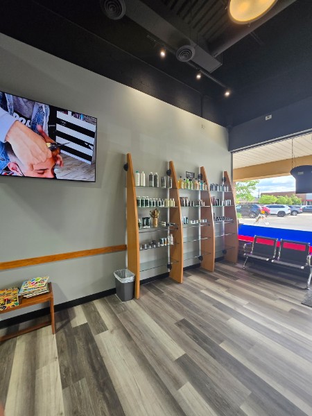 The retail product wall and waiting area inside the salon