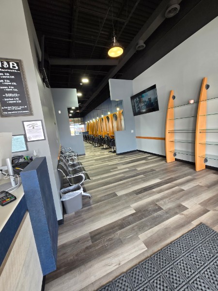 View through the clean and welcoming Men and Boys Haircuts salon