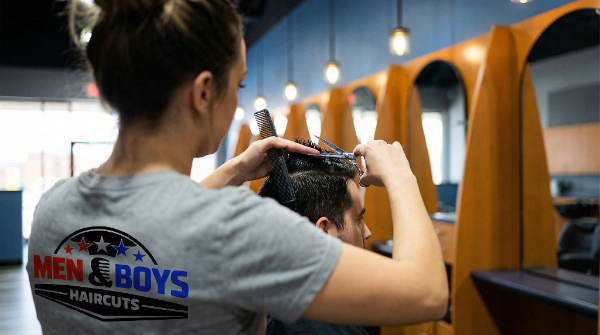 A Men and Boys Haircuts stylist cutting a client’s hair